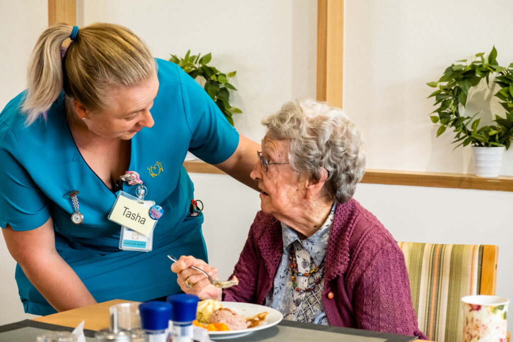 Aged care staff is looking after the residents. 